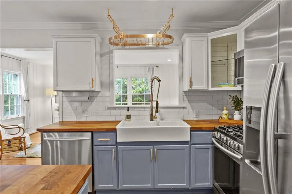 A farm sink and the view to the family room makes this kitchen so easy to want to spend time in.