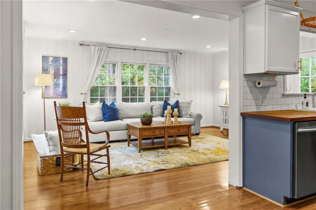 Plenty of natural light in the warm family room with hardwood floors