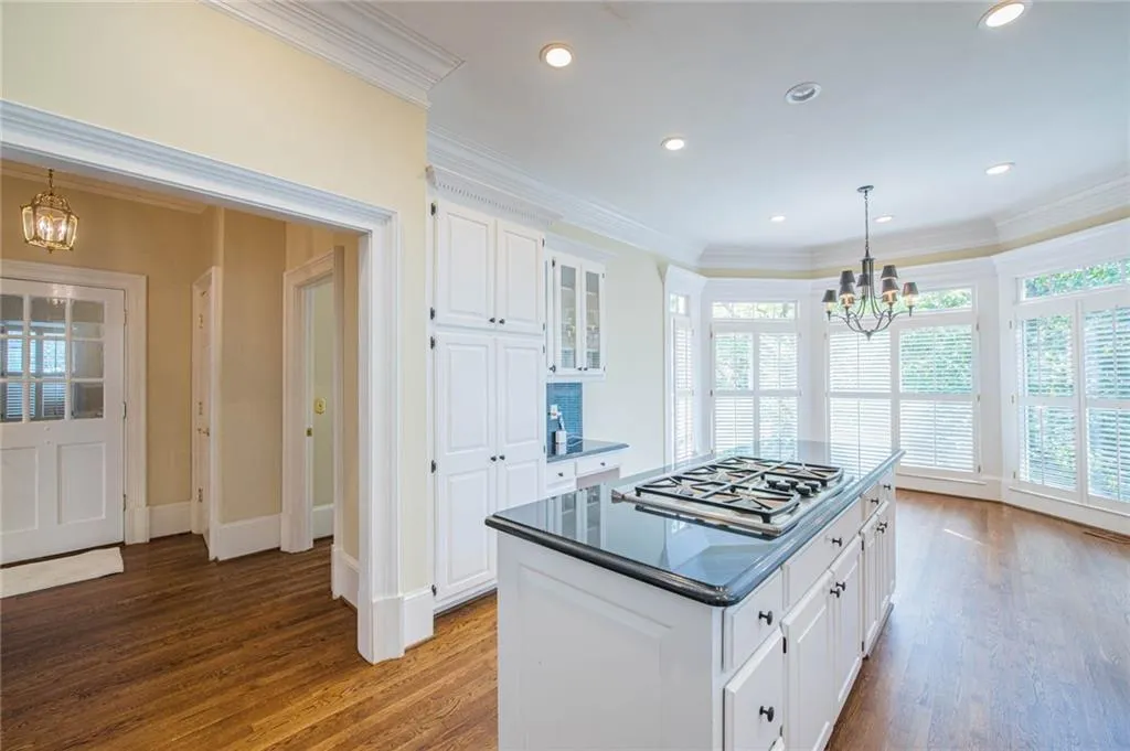 HUGE EAT-IN AREA OF THE KITCHEN WITH WALL OF WINDOWS