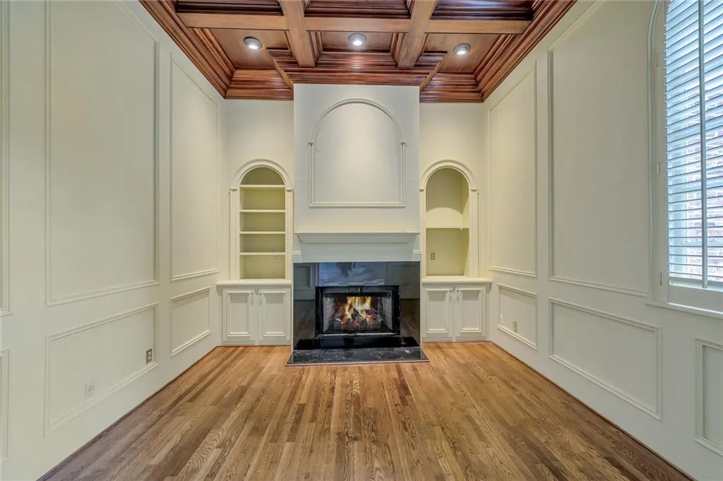 FORMAL LIVING ROOM IS LOCATED OFF THE FOYER. IT HAS A MARBLE FIREPLACE AND LOTS OF NATURAL LIGHT.