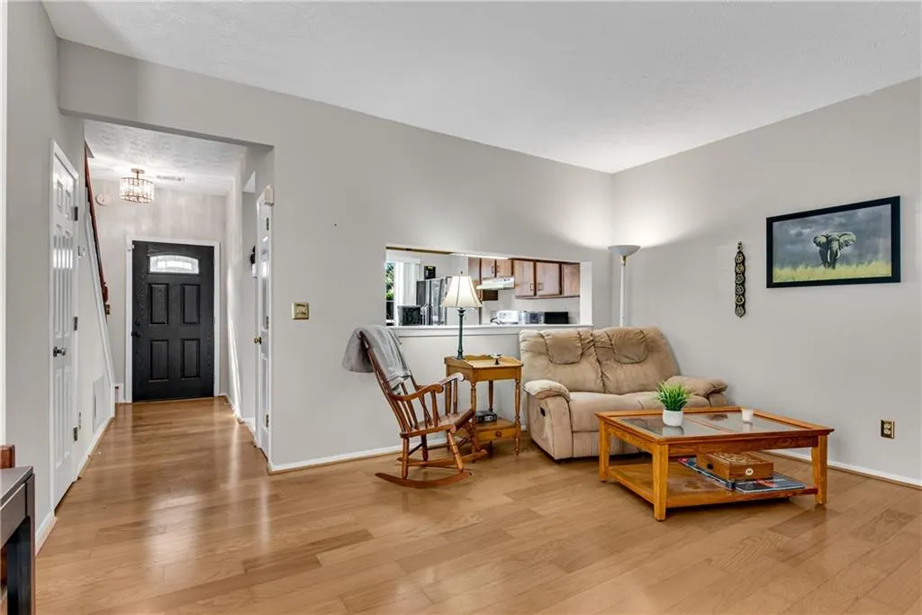 Living room with light wood-type flooring Living room with light wood-type flooring
