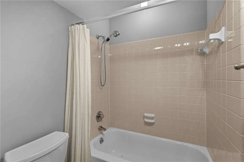 Terrace level tub and toilet view Terrace level tub and toilet view