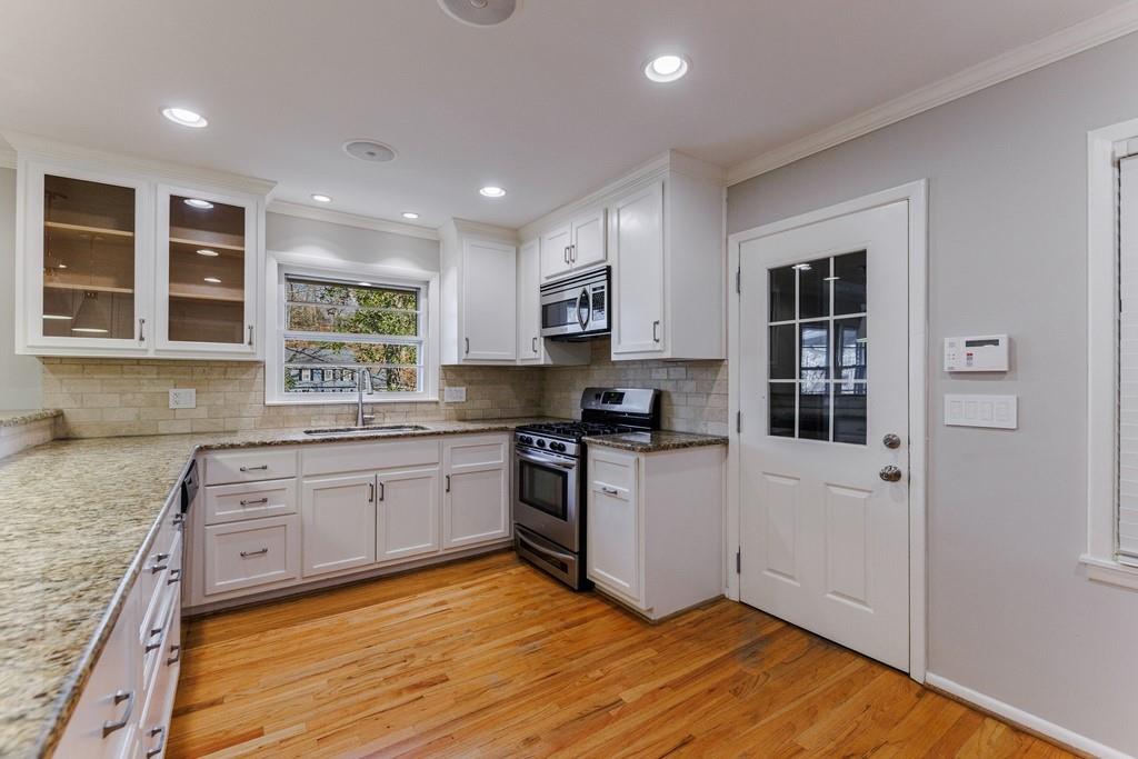 Granite counters and lots of cabinets for storage