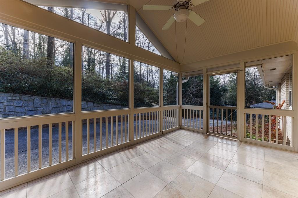 Screen porch has a ceiling fan