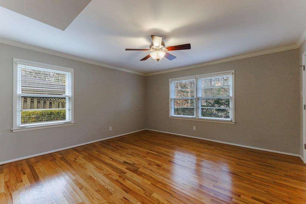 4th bedroom is on the lower level with lots of natural light and hardwood floors.
