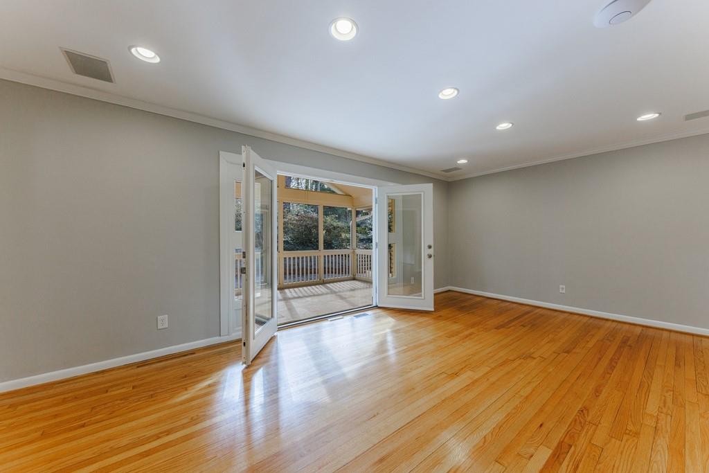 French doors open to the enclosed screen porch