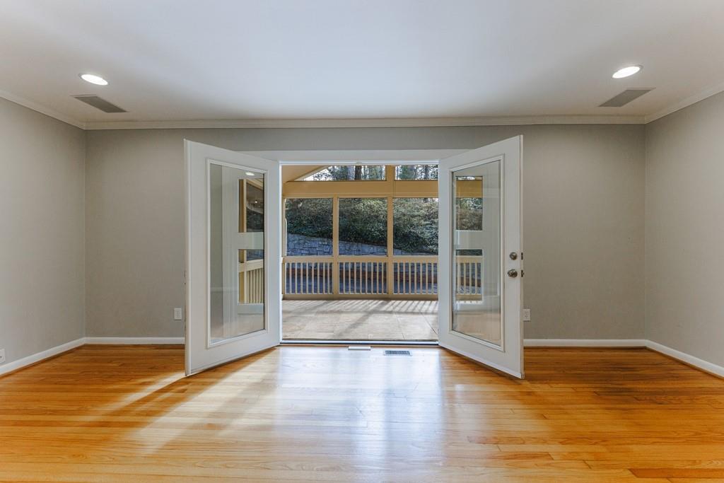 French doors open to the enclosed screen porch