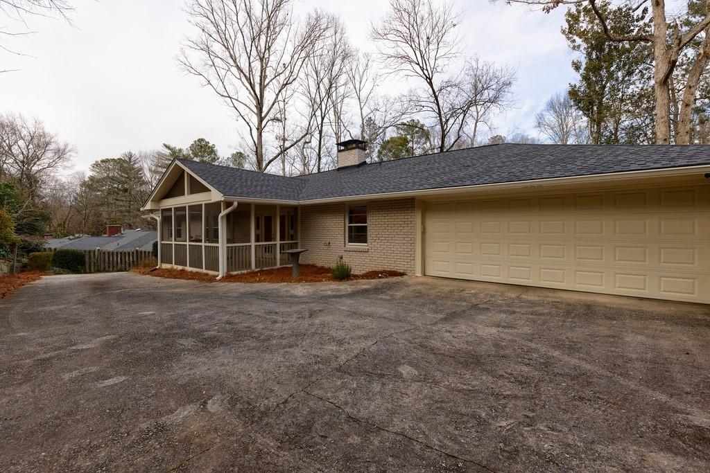Attached 2 car garage has a mudroom and planting room