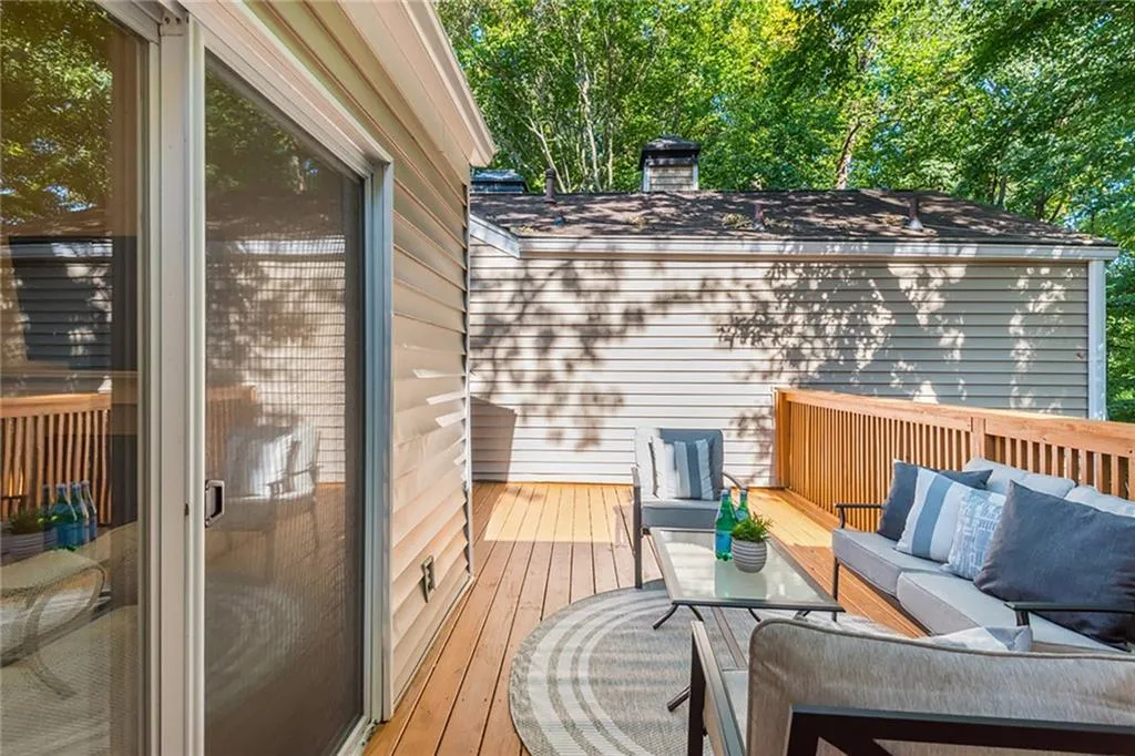 Wooden terrace featuring an outdoor living space