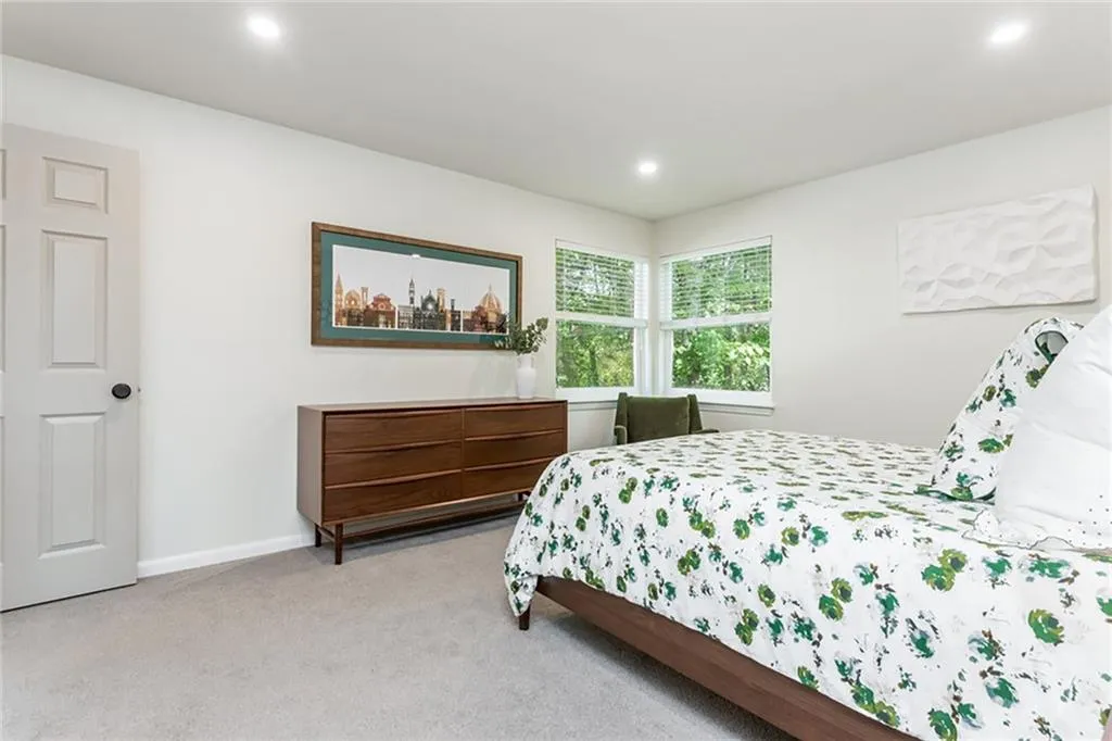 Bedroom with light carpet