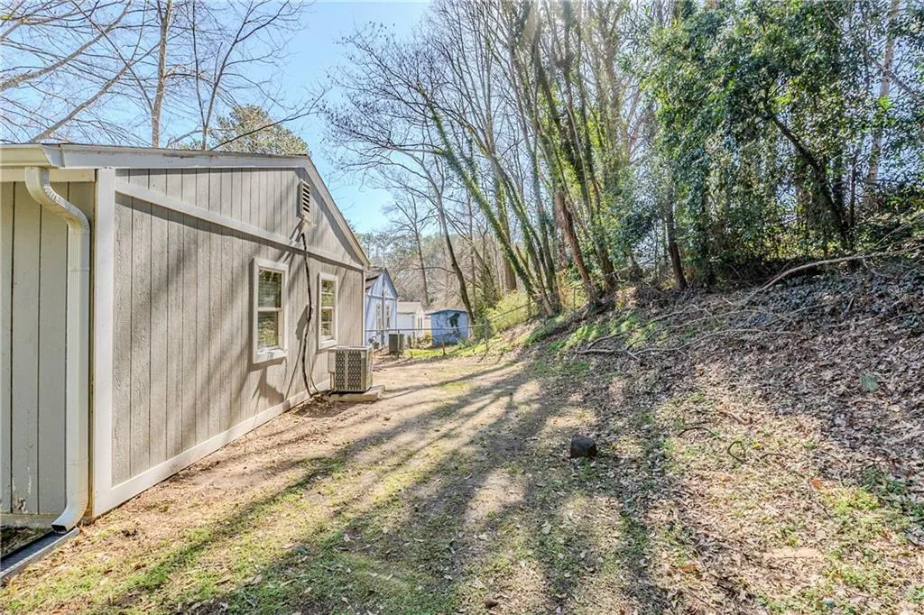 View of yard with central AC