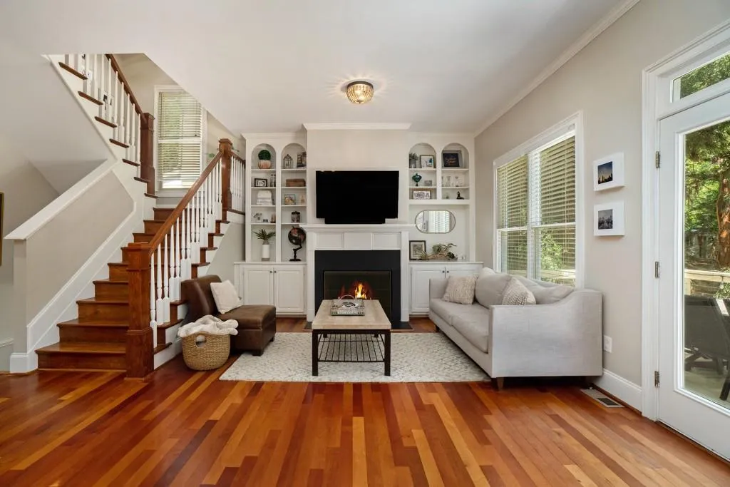 Step inside to find thoughtful design details throughout Hardwood Floors, Soaring Ceilings, Crown Molding, Walls of Windows pouring in Natural Light, and Elegant Glass French Doors.