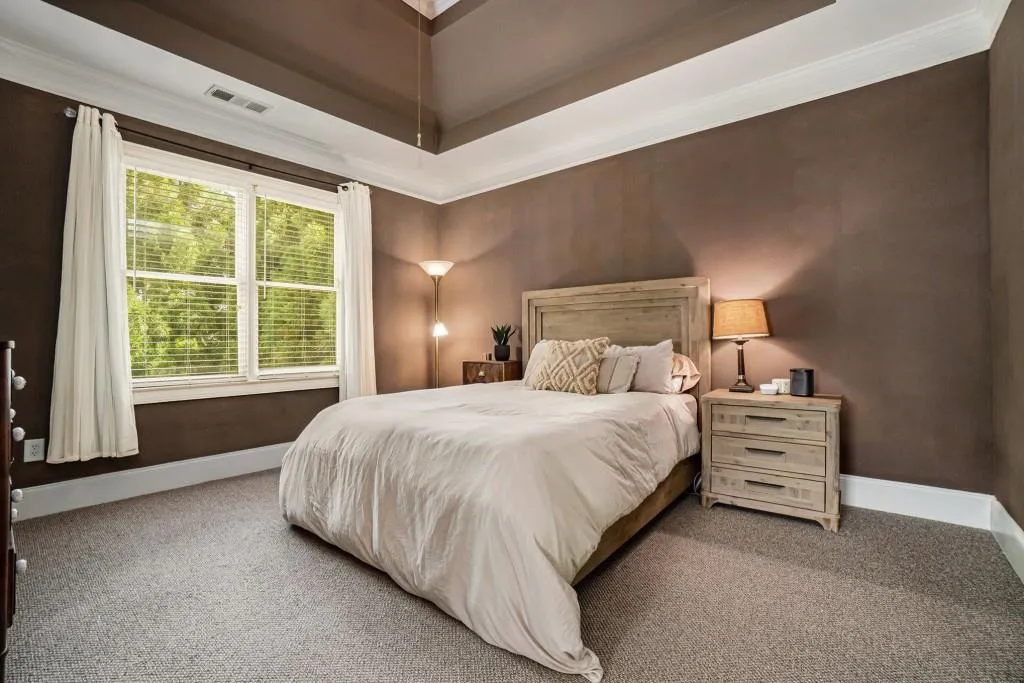 Upstairs, the Spacious Primary Suite features a Tray Ceiling, Walk-In Closet, and a Spa-Style Ensuite with Soaking Tub, Separate Shower, and Dual Vanities.