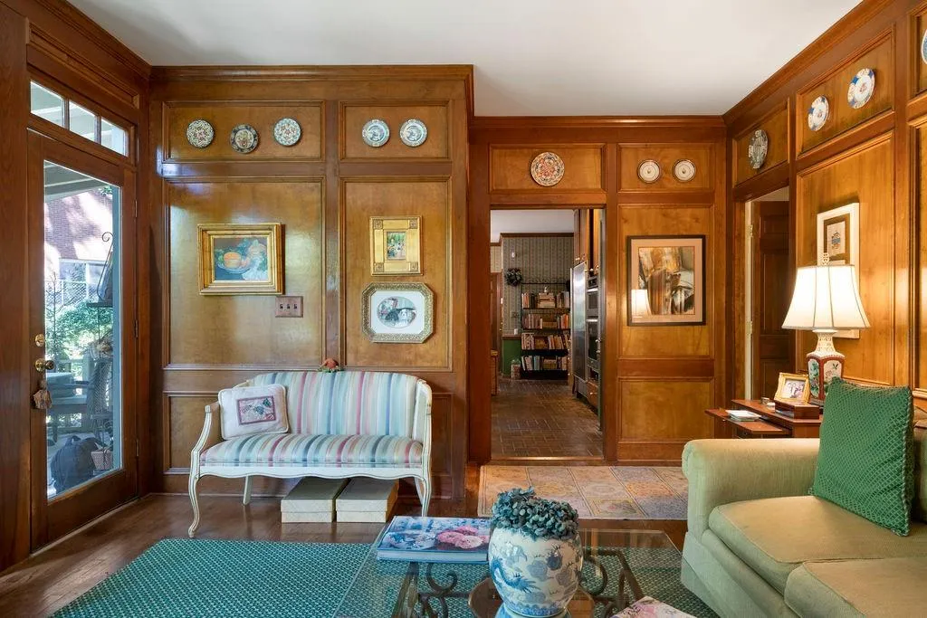 Living area featuring wooden walls