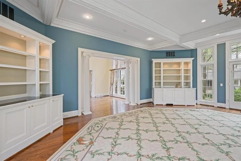 Family Room with Shelving and two doors to outside spaces.