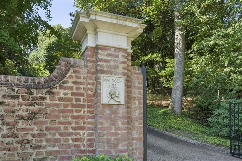 A gated entry with property name, Magnolia Hill.