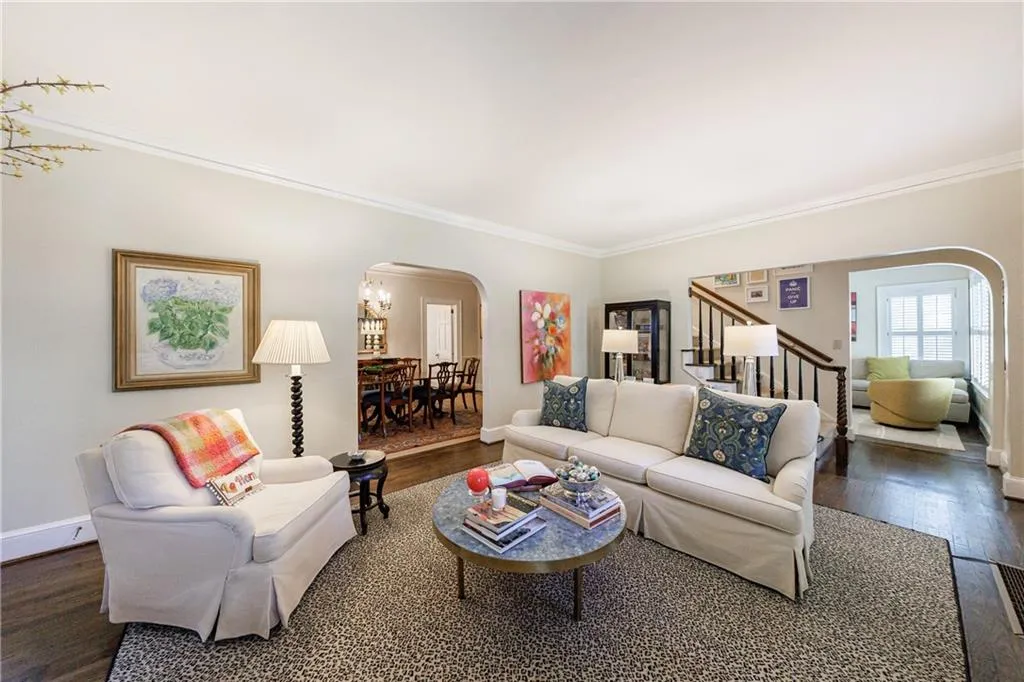 Stairs off the living room lead to the upper two bedrooms and bath