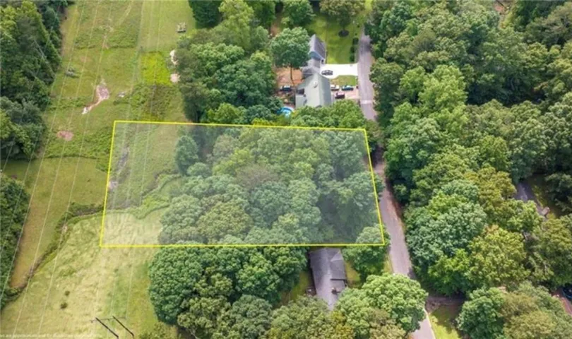 Aerial view of sparsely populated area with property boundaries highlighted