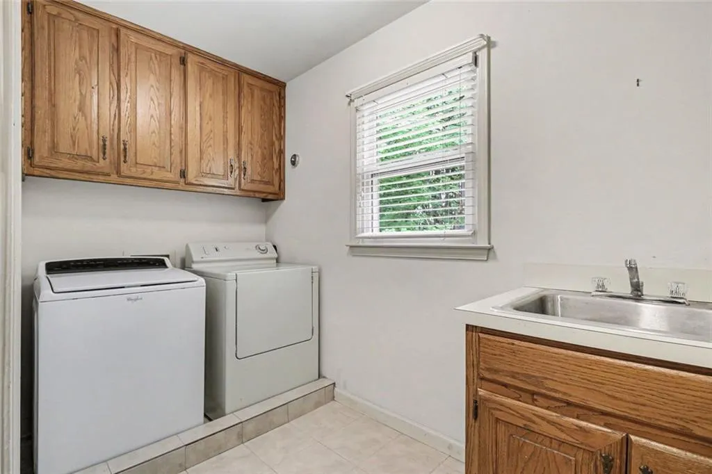 Upstairs Laundry Room With Cabinets & Sink
