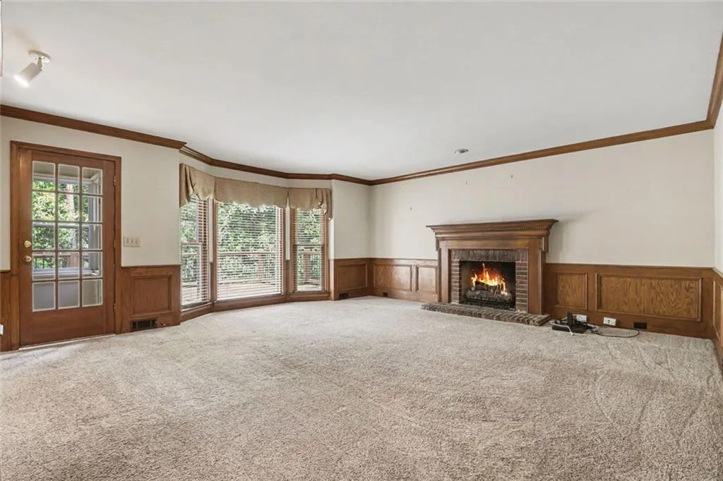 Family Room with Fireplace Overlooking Back Deck