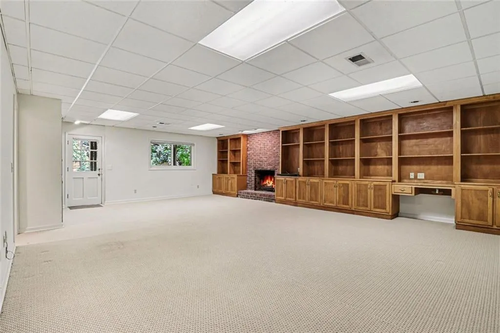Terrace Level with Large Built-In Bookshelves & Fireplace