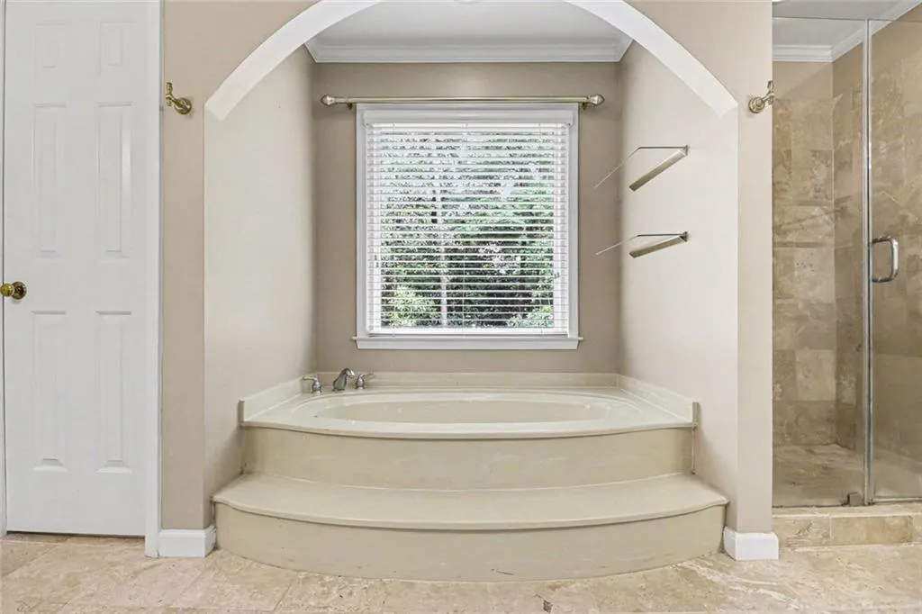 Primary Ensuite with Double Vanities, Soaking Tub, Tile Shower & Linen Closet