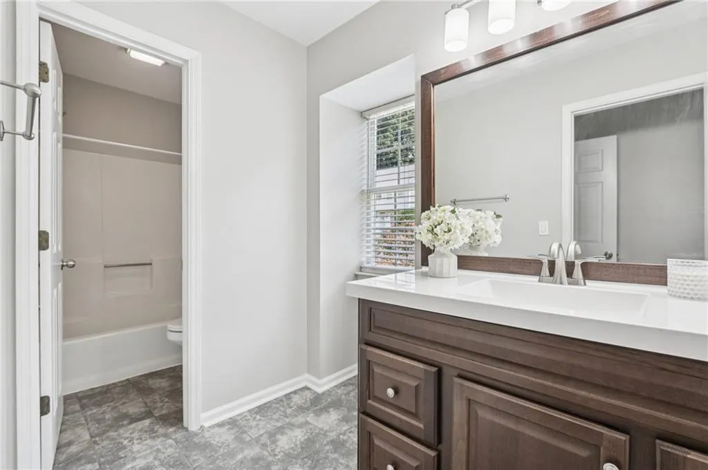 Bathroom featuring vanity and bathtub / shower combination