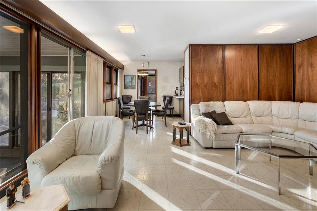 Living room opens to breakfast room and kitchen.