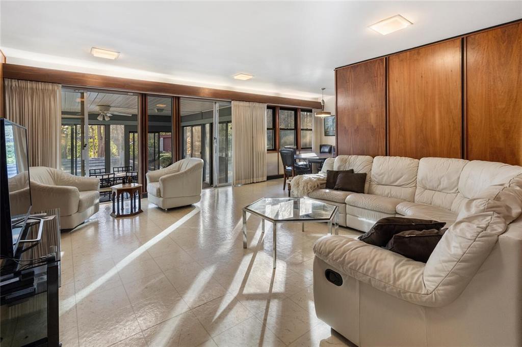 Open living room that overlooks the sunroom.