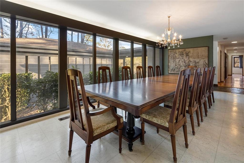 Oversized dining room with a wall of glass.