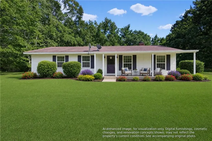 White siding exterior with dark shutters, covered front porch, columns, and a landscaped foundation