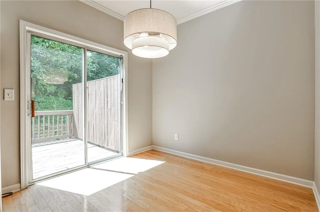 The dining room offers direct access to the back deck—perfect for indoor-outdoor entertaining