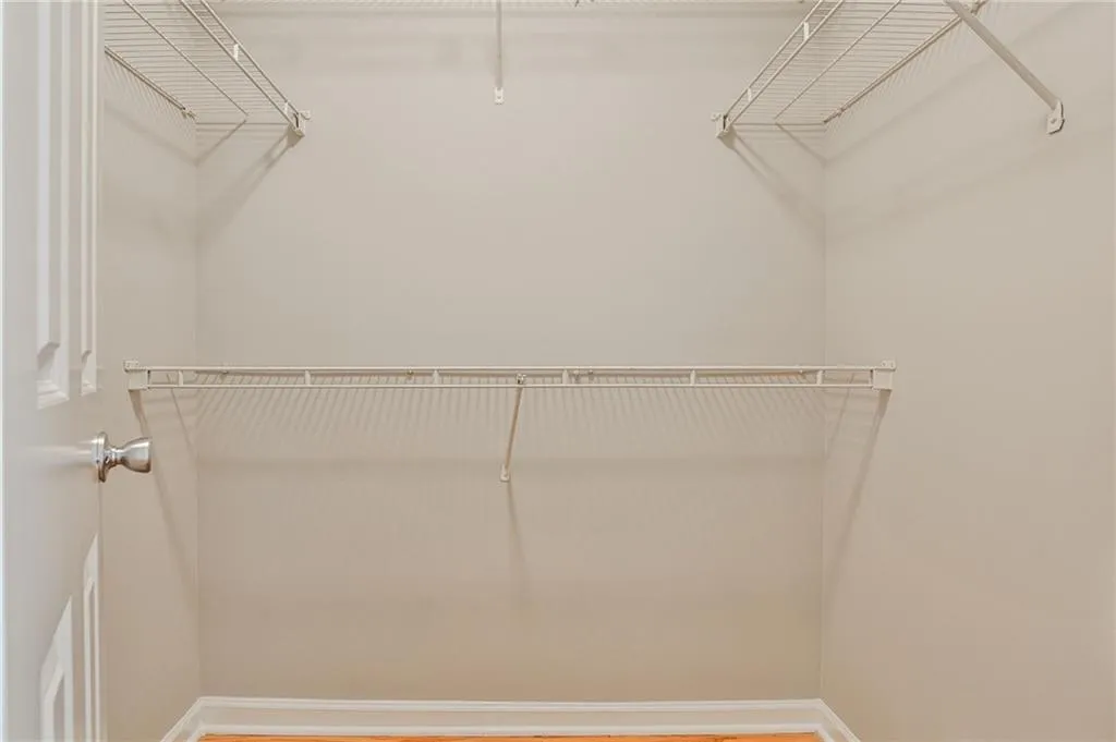 Primary bedroom walk in closet