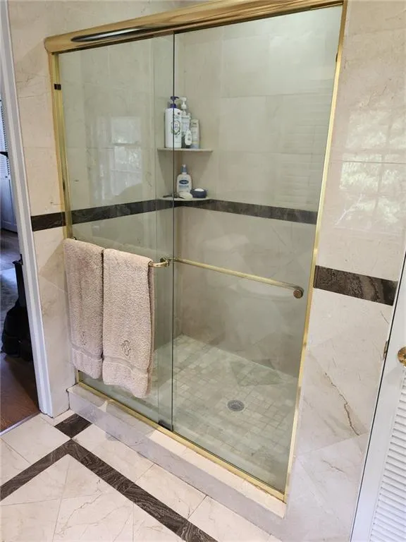 Bathroom featuring a shower stall