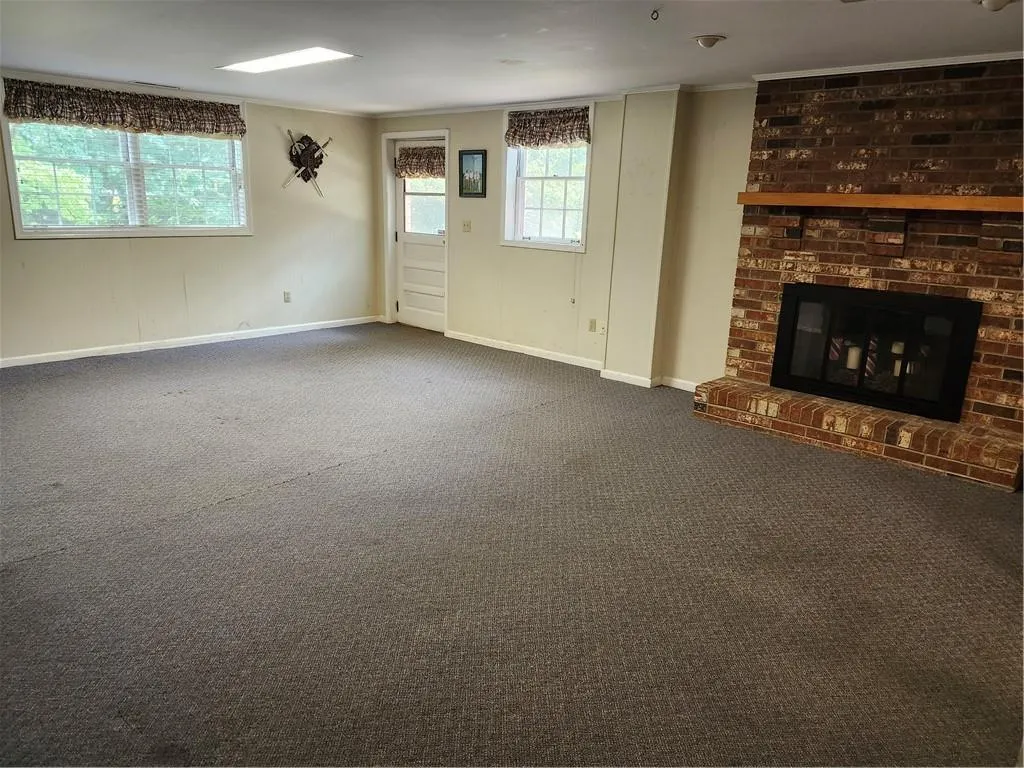 Terrace level entertaining room with fireplace and wet bar.
