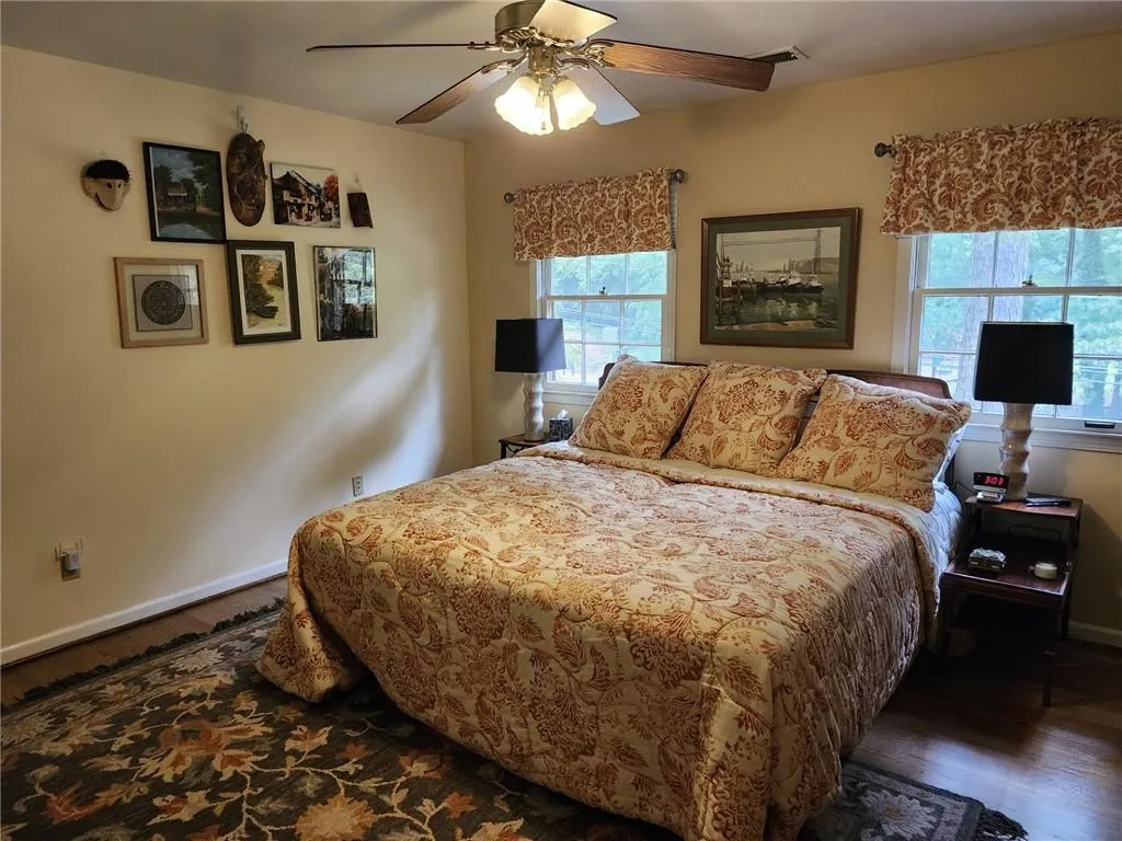 Spacious bedroom with double closets and attic access for easy storage