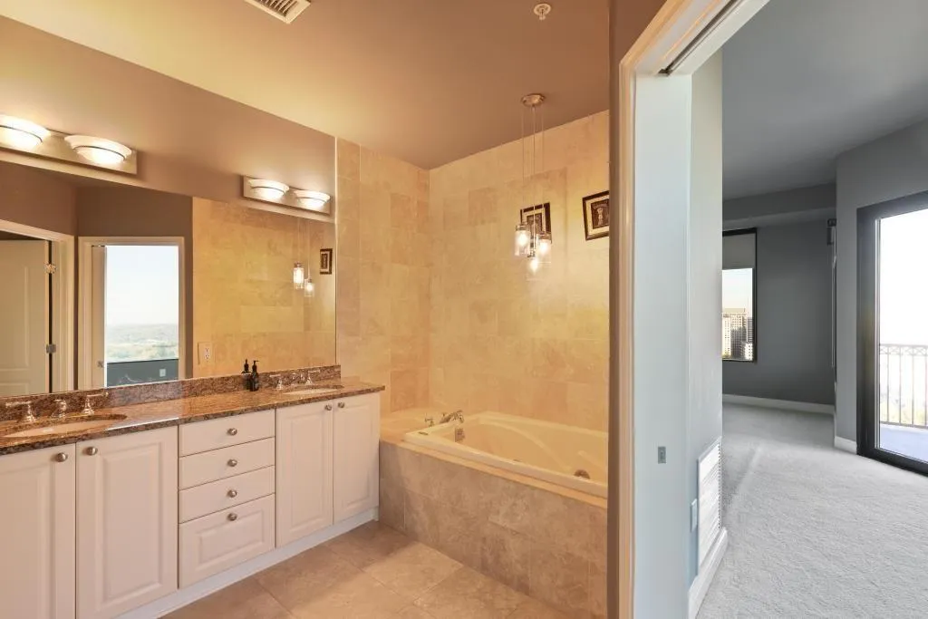 Bathroom with vanity and a relaxing tiled tub