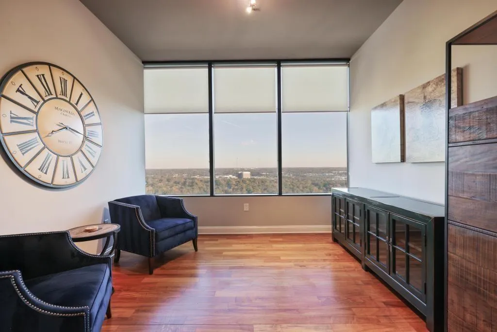Sitting room with hardwood / wood-style flooring