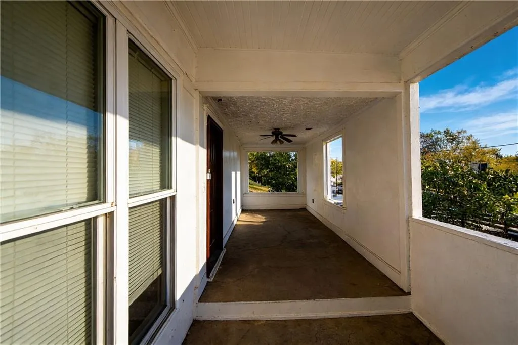 View of patio featuring ceiling fan