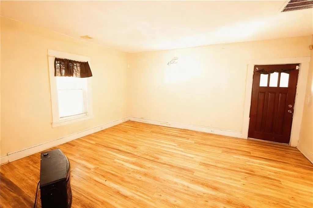 Entryway with light wood-type flooring and healthy amount of natural light