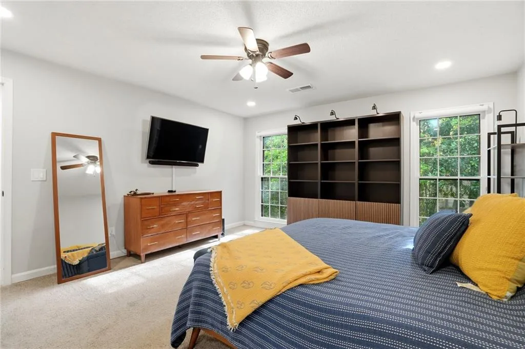 Bedroom with carpet, a ceiling fan, and recessed lighting