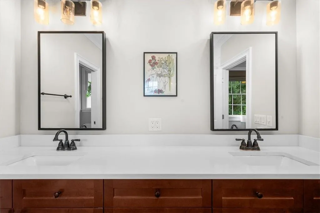 Full bath featuring double vanity