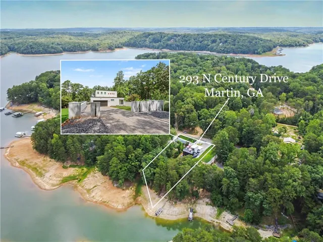 Aerial perspective showcasing the property's expansive waterfront setting with a private boat dock