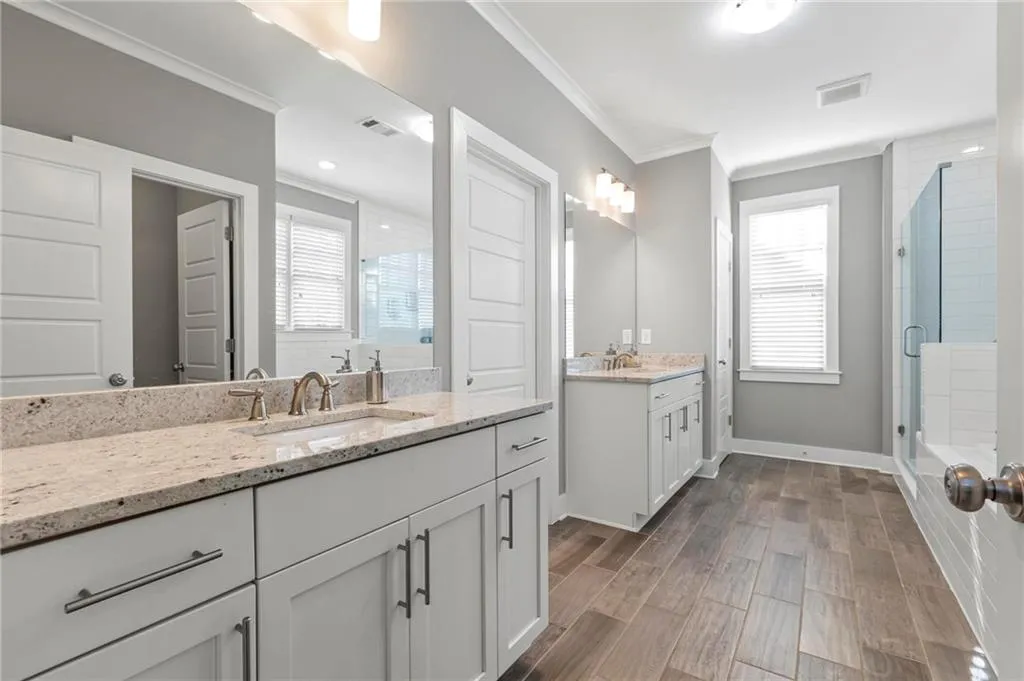 Primary bathroom with rain shower and walk in closet