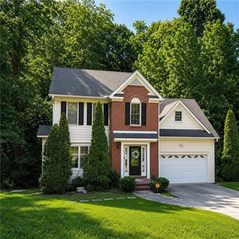 Brick and siding exterior with a two-car garage