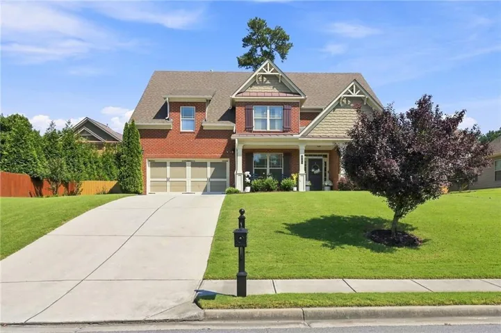 Brick exterior with decorative gables and shutters
