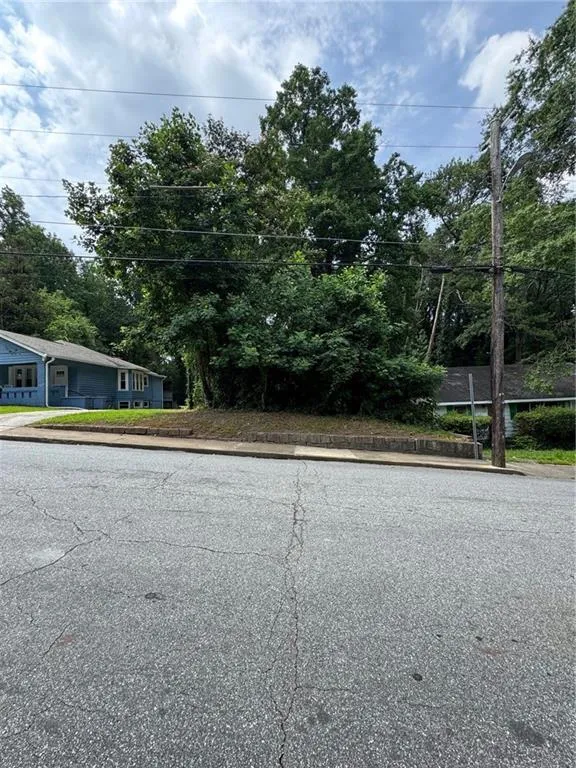View of asphalt road with curbs