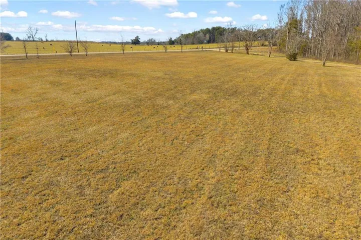 View of green lawn featuring a view of rural / pastoral area