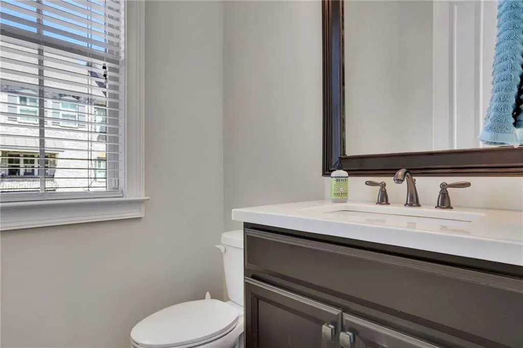 Bathroom with toilet and vanity Bathroom with toilet and vanity