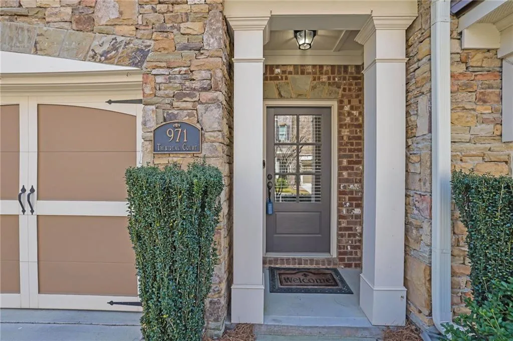 Entrance to property featuring stone siding Entrance to property featuring stone siding